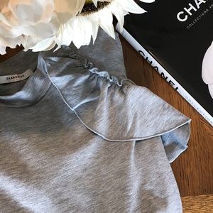 Cold shoulder ruffled sweater